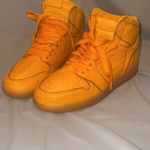 pair of Nike Air Jordan 1 Retro High OG G8RD "Orange Peel"